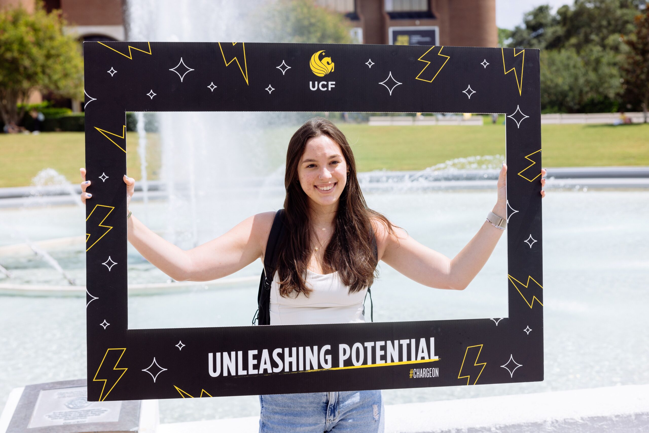 Student holding up a sign
